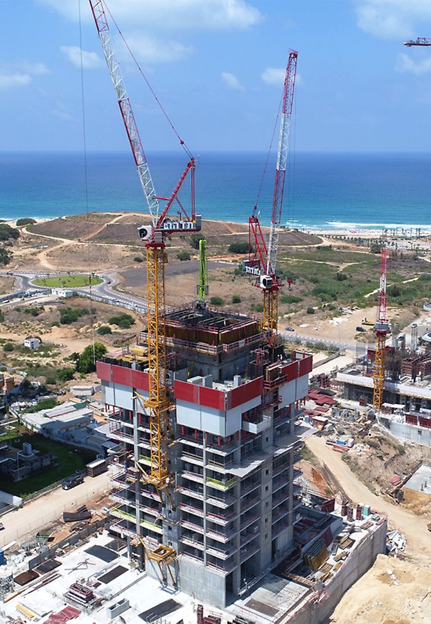 תכנון הנדסי המאפשר ניתוק הגרעין המרכזי מתקרות בהיקף ויציקת הגרעין 3-4 קומות מעל מפלס התקרה וחמשת הממ&quot;דים