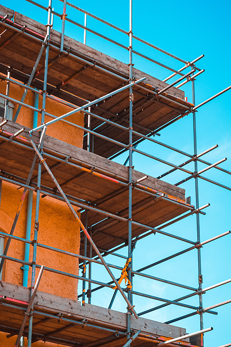 Tube and fit scaffolding. Surely using non-combustible materials around buildings that pose a fire risk should be a priority?
