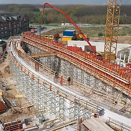 Catholic Church Centre, Cologne-Blumenberg, Germany - 6 m long units with frames comprised of U 120 steel walers were positioned in pairs after the supporting scaffold, consisting of ST 100 stacking towers, had been adjusted.