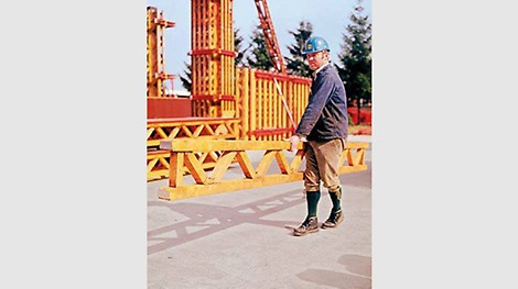 &lt;p&gt;The first girder is produced, the PERI T 70 is born. T stands for the German word &quot;Tr&amp;auml;ger&quot; (girder) - 70 for the chord thickness in millimeters. The first order was for 80 girders with a length of 3.05 m. The girders were impregnated by hand with a sponge over a plastic tub and directly loaded on the waiting truck. The annual output was about 50,000 linear meters.&lt;/p&gt;<br/>