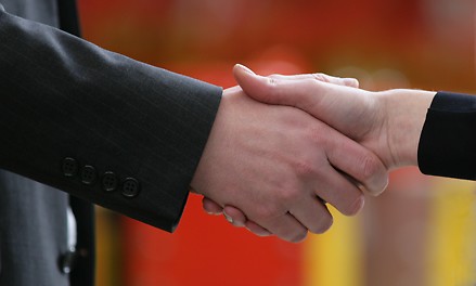 Business Partners The picture shows how two business partners shake hands.