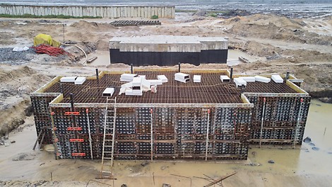 Construction of foundation blocks to carry gas compressor machinery. 180 cubic meter foundations with dimension 13m x 5m x 2.8m. The number of foundation blocks to be constructed is 10.