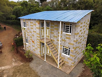 TwistBlock technology reaches Uganda. The blocks are produced locally, made by hand with our TwistBlock Mould, and assembled without mortar.