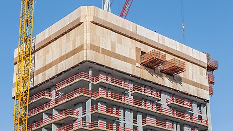 The project-specific customized climbing formwork solution Henninger Turm, Frankfurt am Main: The upper landing platforms were integrated into the RCS enclosure and climbed crane-independently together with the protection panel unit to the next section in each case. In the floors immediately below, crane-movable RCS MP Landing Platforms served as a temporary storage areas for crane transportation.