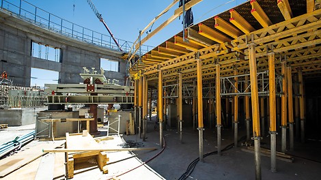 Shoring Solution Shoring construction consisting of ST 100 stacking towers for load transfer of the cantilevered platform at the top