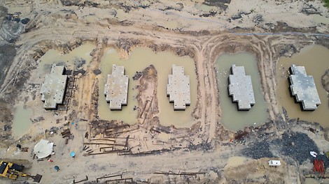 Construction of foundation blocks to carry gas compressor machinery. 180 cubic meter foundations with dimension 13m x 5m x 2.8m. The number of foundation blocks to be constructed is 10.