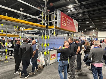PERI's stand at SCAFFEX 24. PERI UK exhibition stand at ScaffEx 2024 with attendees discussing scaffolding solutions.