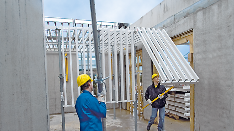 Safe shuttering procedure by swivelling the panels upwards with site personnel positioned on the slab below.