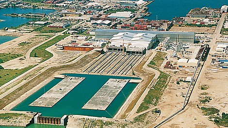 The two 176 m long and 57,000 t tunnel sections swimming in the flooded dry docks, ready to be towed out.