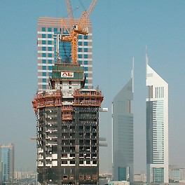 21st Century Tower, Dubai, United Arab Emirates - The RCS climbing protection panel complete encloses the upper floors under construction and provides protection against wind and weather - and increases productivity.
