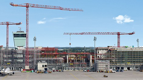 Munich Airport Satellite Terminal, Germany - The 600 m long, new satellite terminal at Munich airport is located in the centre of the airfield and encloses the apron tower and incorporates the existing baggage sorting centre. Construction is taking place during normal airport operations and presents an enormous challenge to all those involved in the project.