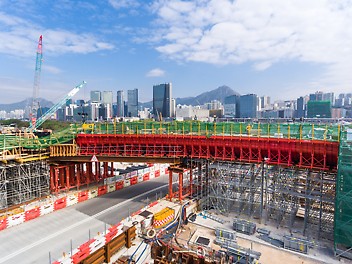 Heavy shoring for portal openings in falsework for nearby link walkway