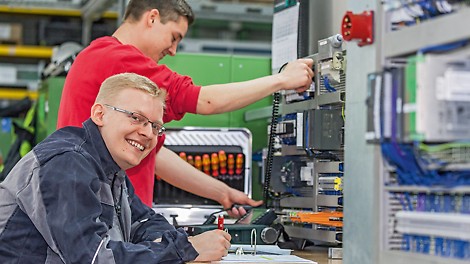 Two young workers of the electronic department at PERI Weißenhorn