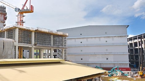 An overview of an old warehouse at the foreground that are waiting to be demolish in order to build a new warehouse by using PERI systems.