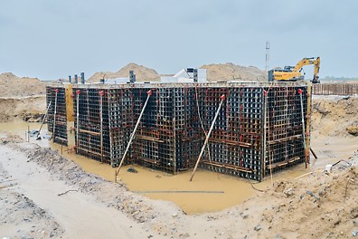 Construction of foundation blocks to carry gas compressor machinery. 180 cubic meter foundations with dimension 13m x 5m x 2.8m. The number of foundation blocks to be constructed is 10.