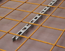 Linear spacer with cut-outs, to ensure maintenance of specified cover to the reinforcement