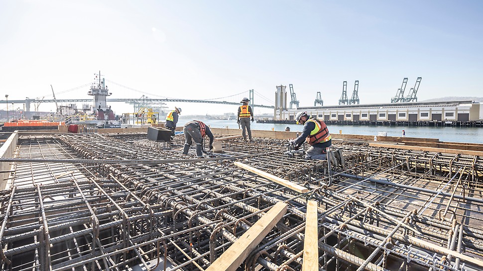 Final touches to the rebar cages in preparation for the concrete pour on the Marine Oil Terminal. Customer was impressed with how sturdy and rigid the falsework behaved and their crews felt very safe working on it.