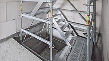 In shell construction, temporary staircases can be built with PERI UP. Through the 25-cm grid dimensions, all bays can be completely closed to offer maximum safety.