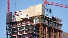 TrIIIple, Vienna, Austria: The VST Heavy-Duty Shoring Towers are secured to the building by retaining structures. The surface-mounted distribution platform serves to accommodate the PERI UP scaffolding.