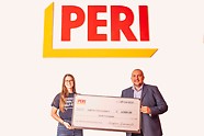 Strydom Groenewald, CEO of PERI USA, presented a $4,000 check to Victoria Onufrieff, donor database and relations specialist for Habitat for Humanity Chicago