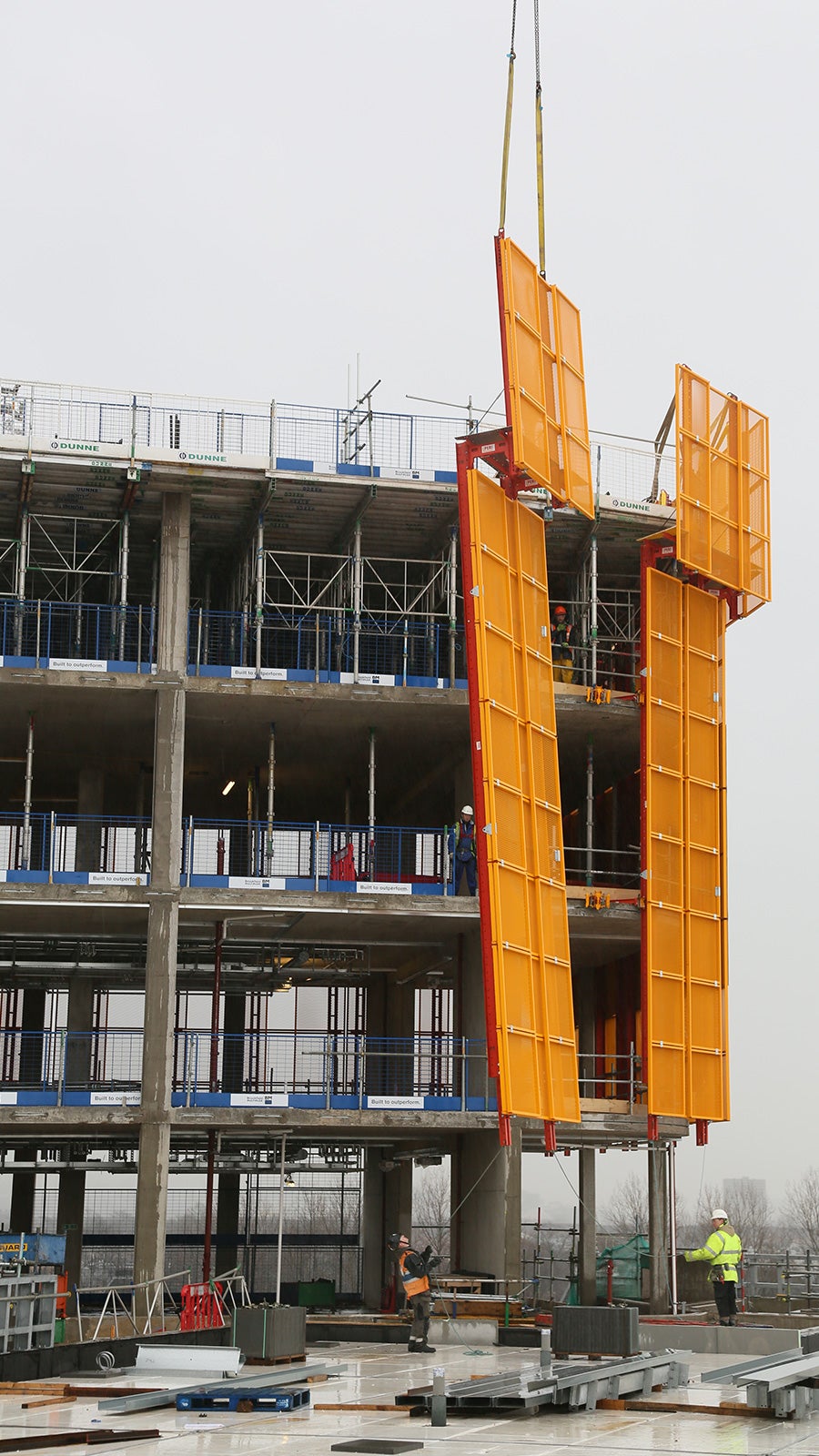 Completed LPS Screens being craned into place to cover all floors and protect the workforce at height