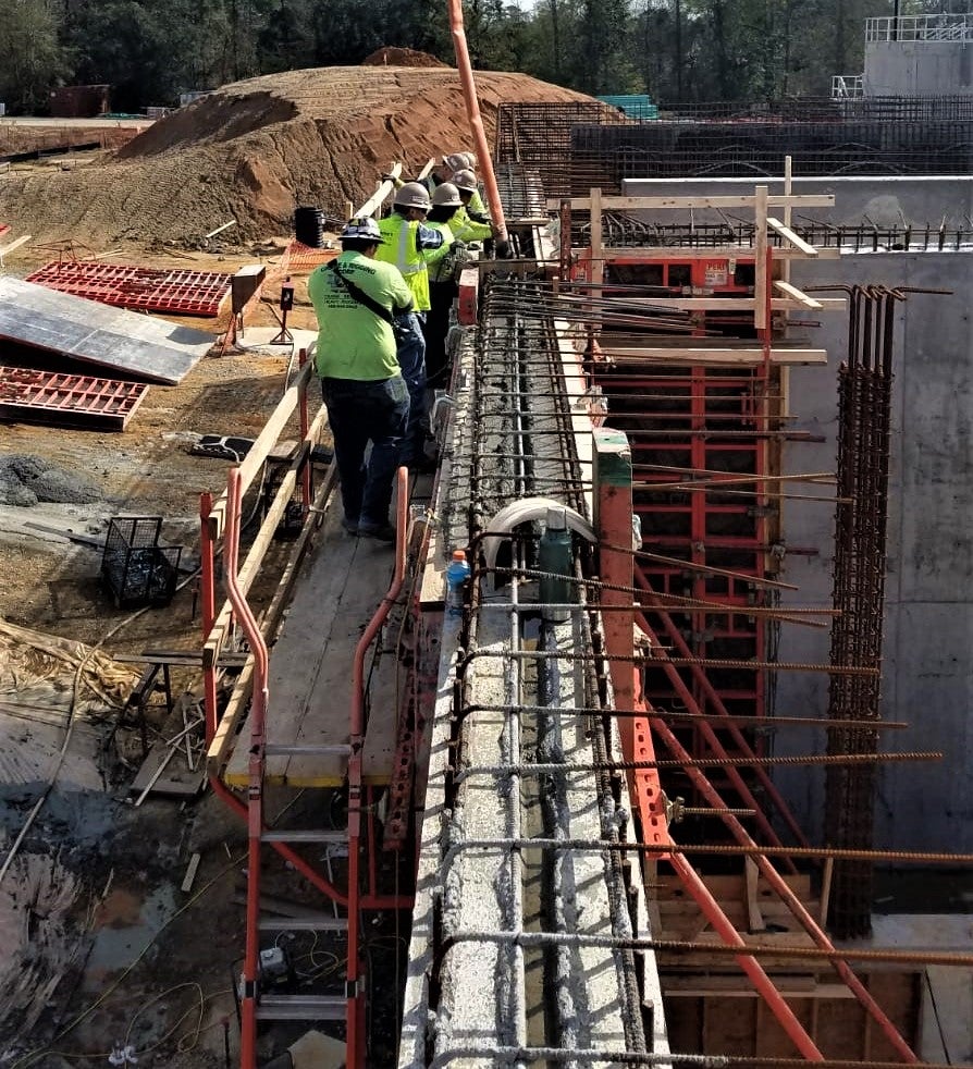 Crews pouring the wall