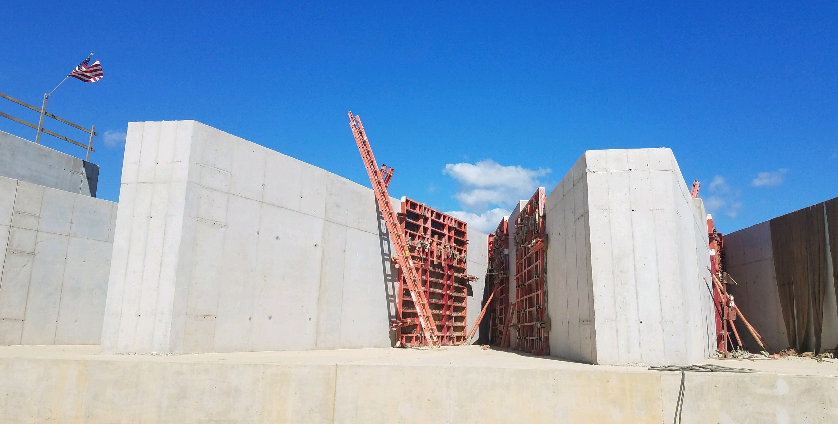 Spillway walls up to 20 feet tall were added to the dam. 