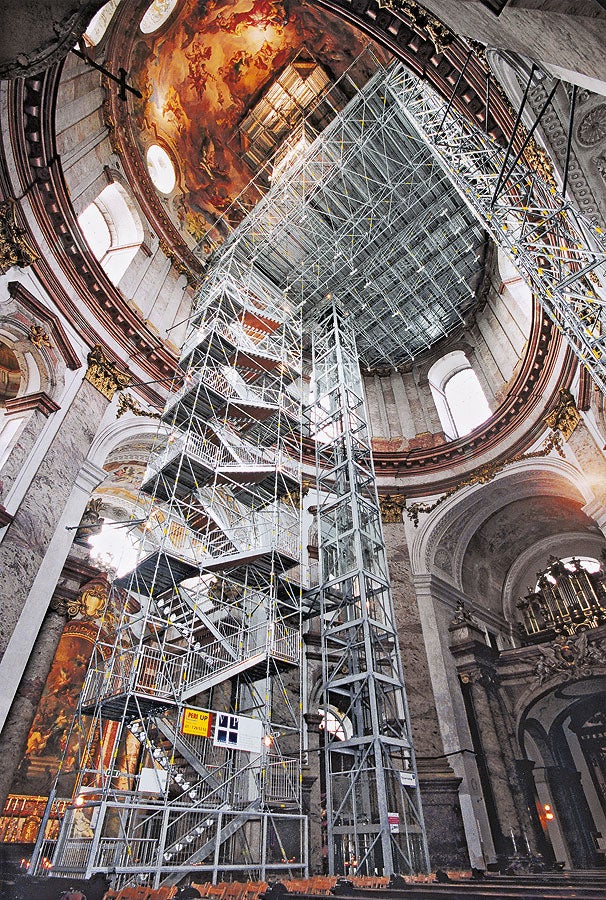 PERI UP Rosett Public Stair as stair tower inside a church which serves as an emergency stairway in case the electrically-operated elevator breaks down.