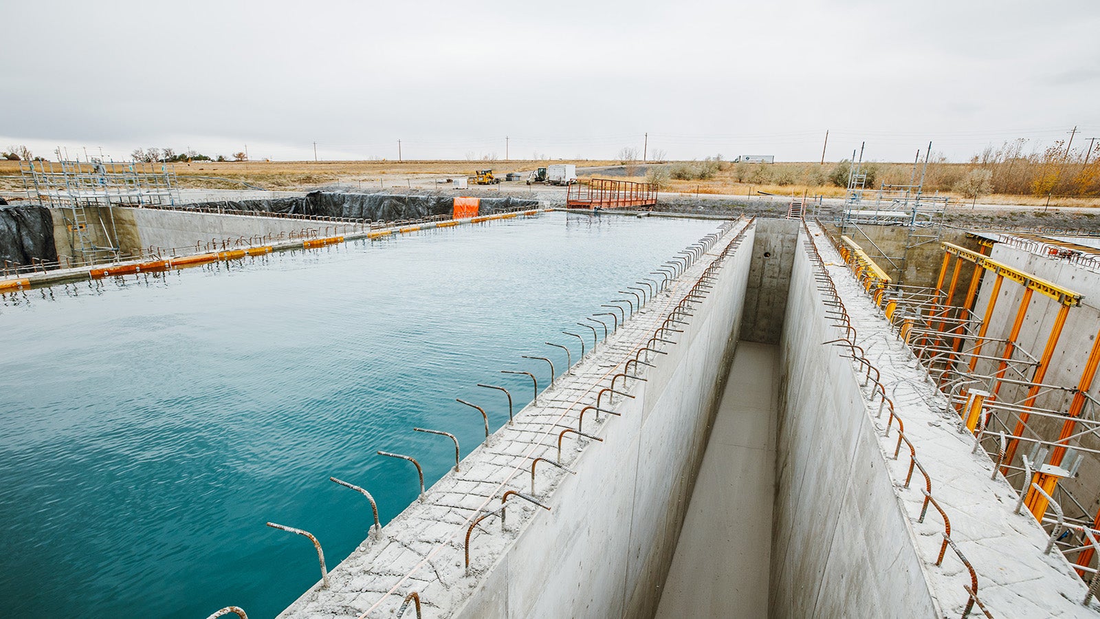 Water tank being filled to test watertight integrity. She-bolts with integrated waterstops ensure a leak-proof structure.