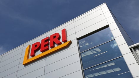 Exterior view of the PERI UK office, featuring the company logo, signifies a commitment to supporting employees with new menopause guidance. Illustrating workplace wellness and inclusivity.