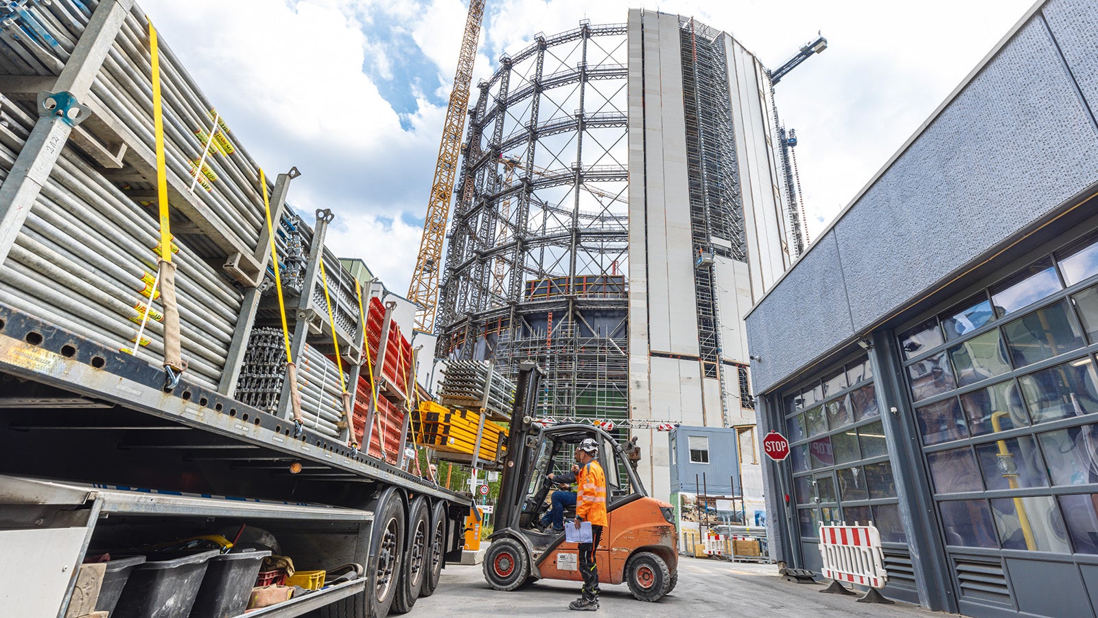 A new, circular building with 15 floors was constructed inside the steel structure.