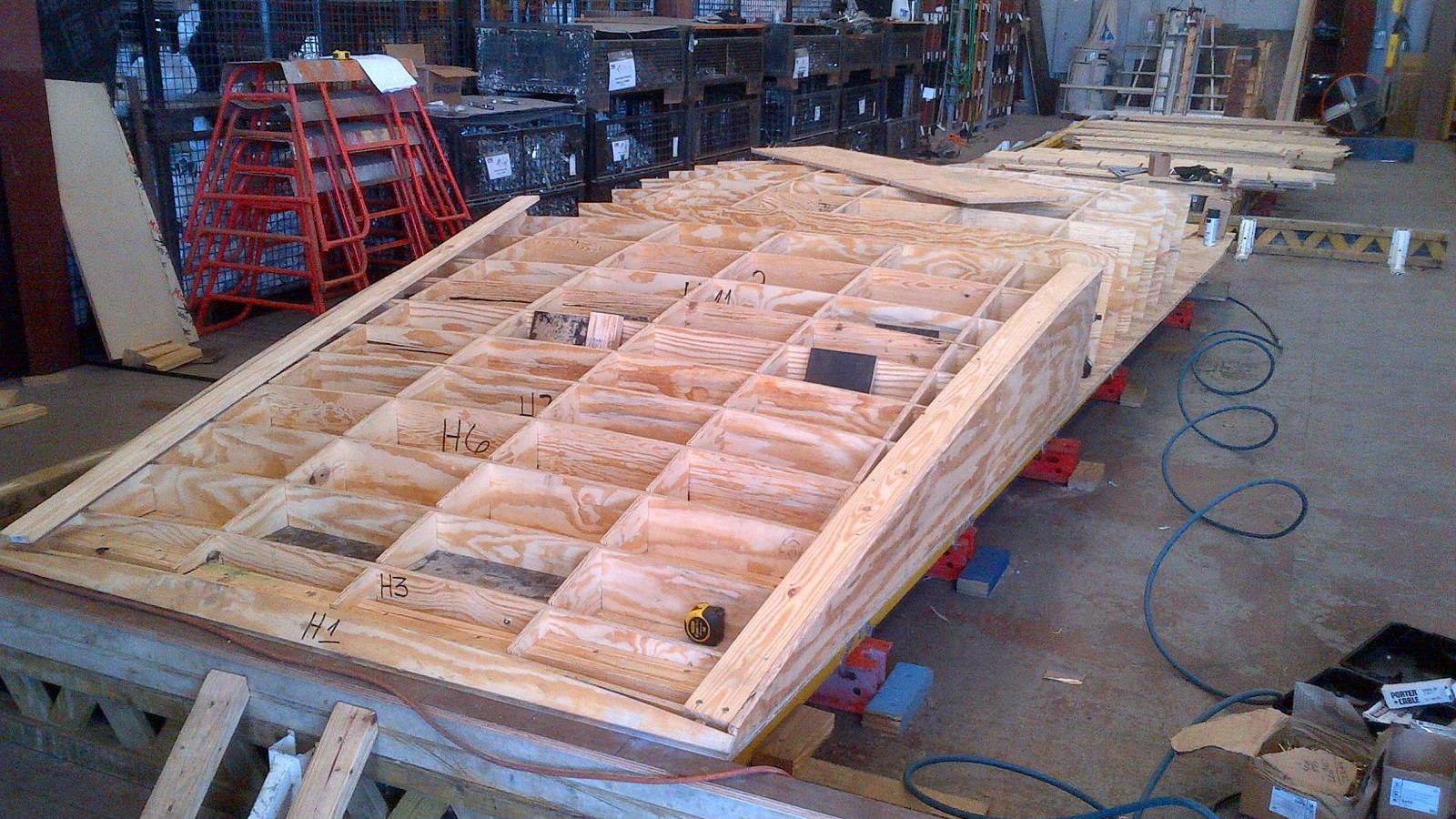 Creation of custom forms to accomodate sloped walls with architectural concrete finish.