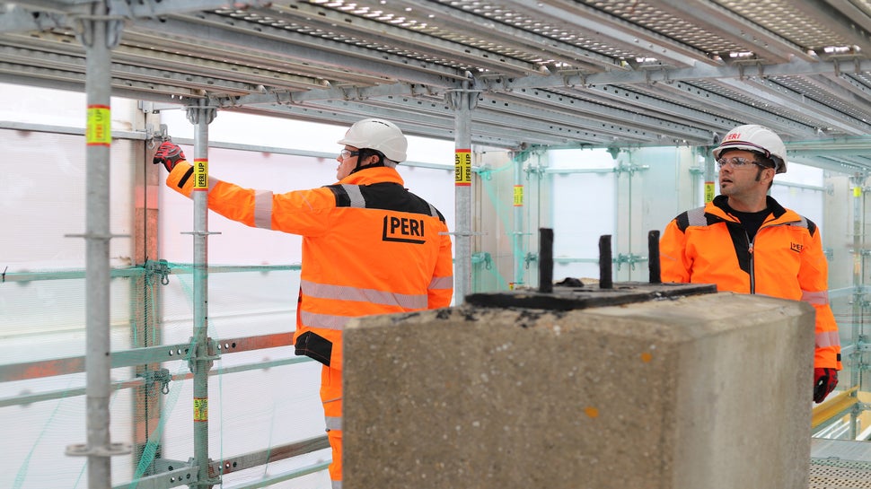 View from inside the PERI UP Cladding enclosure on the Old Cock Footbridge, showing how the translucent panels create a safe, bright, and contained working environment.