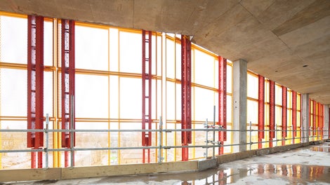 View of the LPS screens in place from the inside of the building, demonstrating the mesh panel allowing excellent daylight into the building