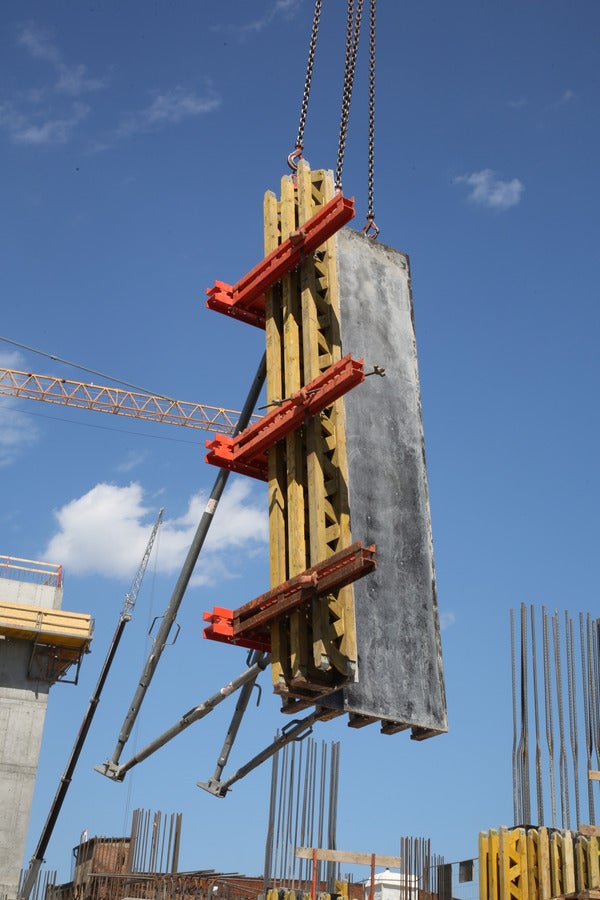 through individual arrangements of formwork girders and steel walers.