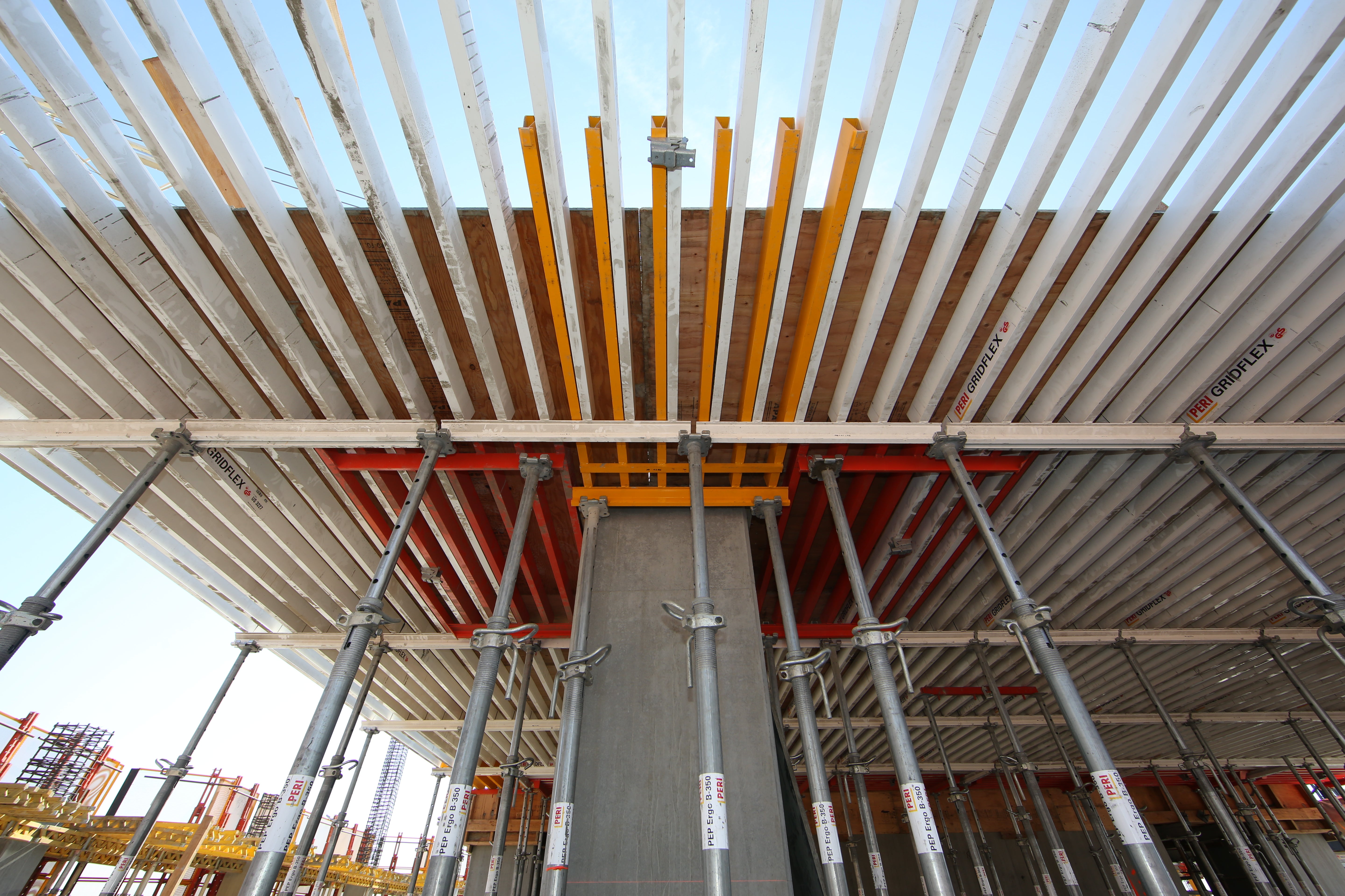 The decks were formed using the PERI GRIDFLEX grid panel formwork system. The lightweight slab formwork system goes up very quickly and plywood is nailed directly into the aluminum panels.