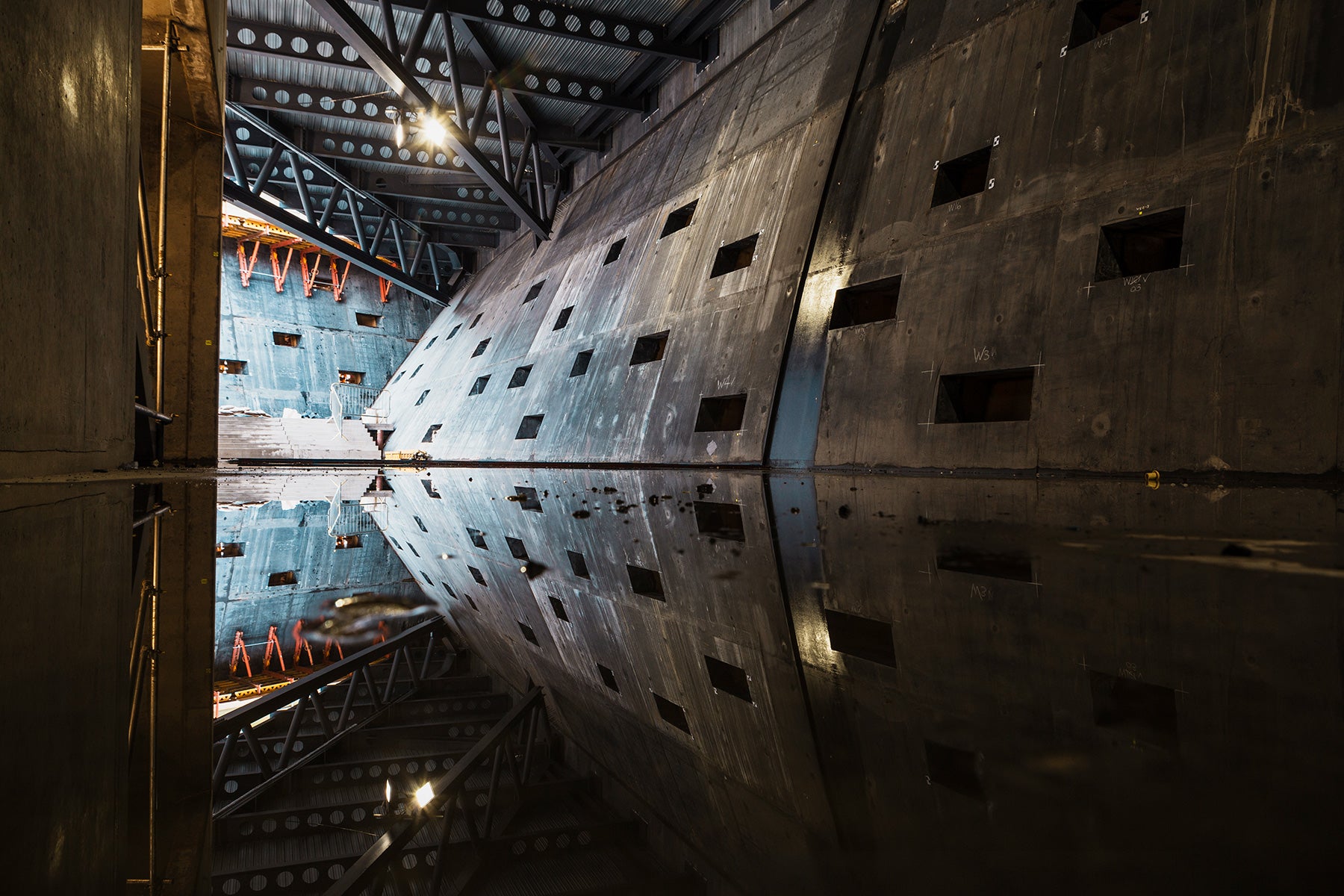 Black architectural concrete shapes the unusual geometry of the museum