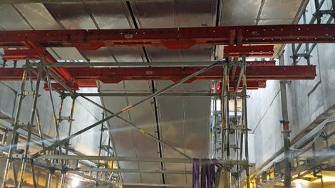 Udveksling i bunden af rulletrapperne