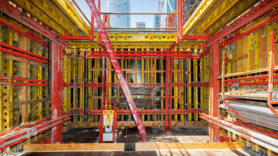 Multiple rail climbing systems keep formwork and protective panels moving ahead.