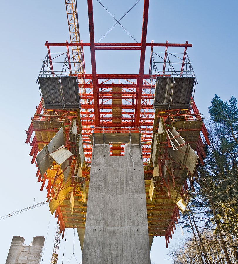 For moving past the bride piers, the slab formwork is simply folded downwards hydraulically.