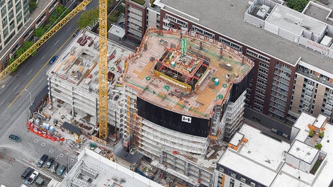 PERI’s RCS P Perimeter Protection, with integral RCS outriggers and PERI UP Stair Towers, gives crews easy access while also ensuring safety on an urban site surrounded by existing buildings.