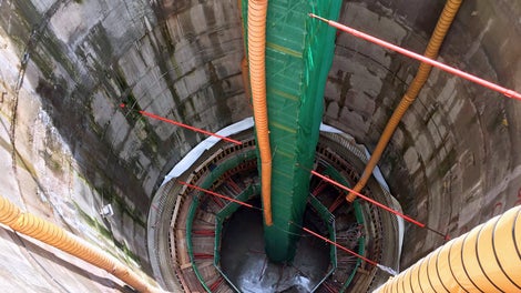 PERI UP Flex Stair 75 are covered with netting for safety.