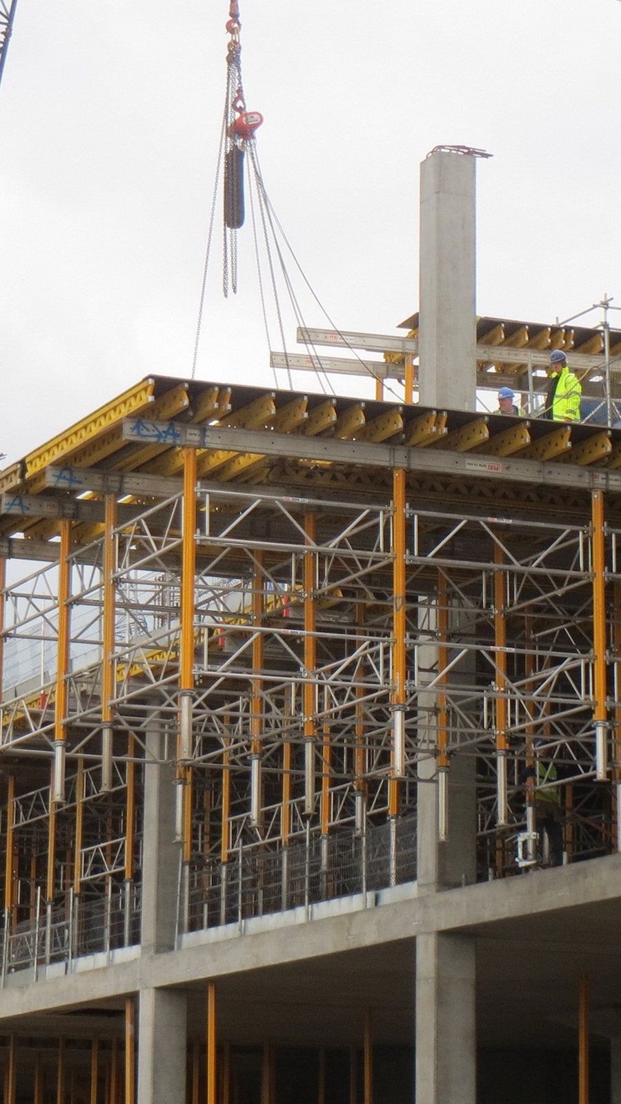 Crane moving complete MULTIPROP Table of 72m2, weighting 4.5 tonnes from block level 2 to the roof. The tables were pre-assembled on castors for easy re-location between floors and areas