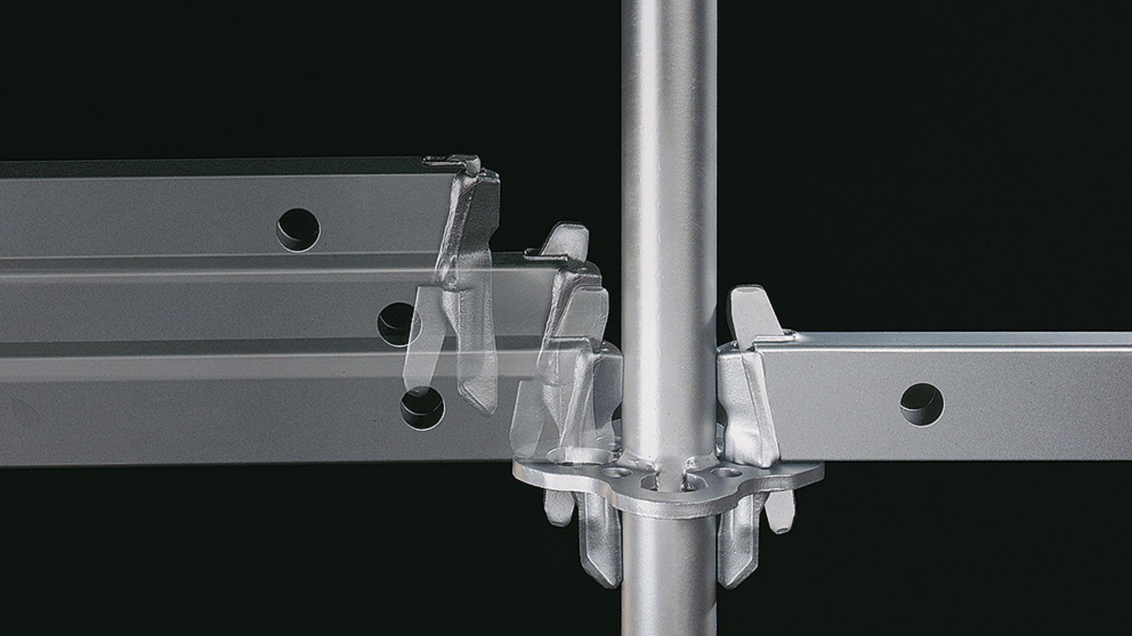 The gravity lock facilitates fast assembly of the modular scaffolding: by inserting the wedge head into the rosette, the wedge drops by force of gravity into the hole and then locks.<br/>