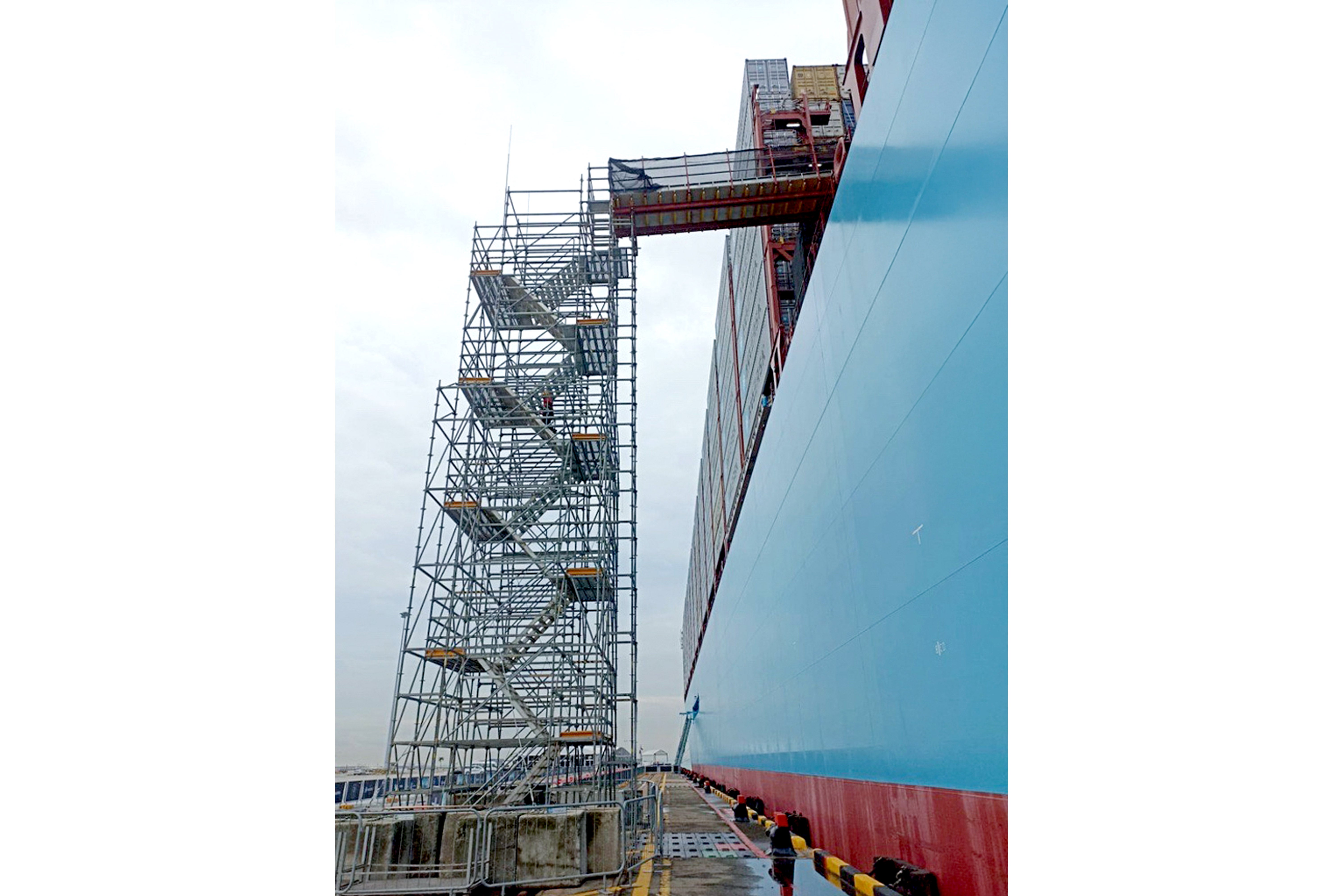 Gangway erected and secured to stair tower to the vessel