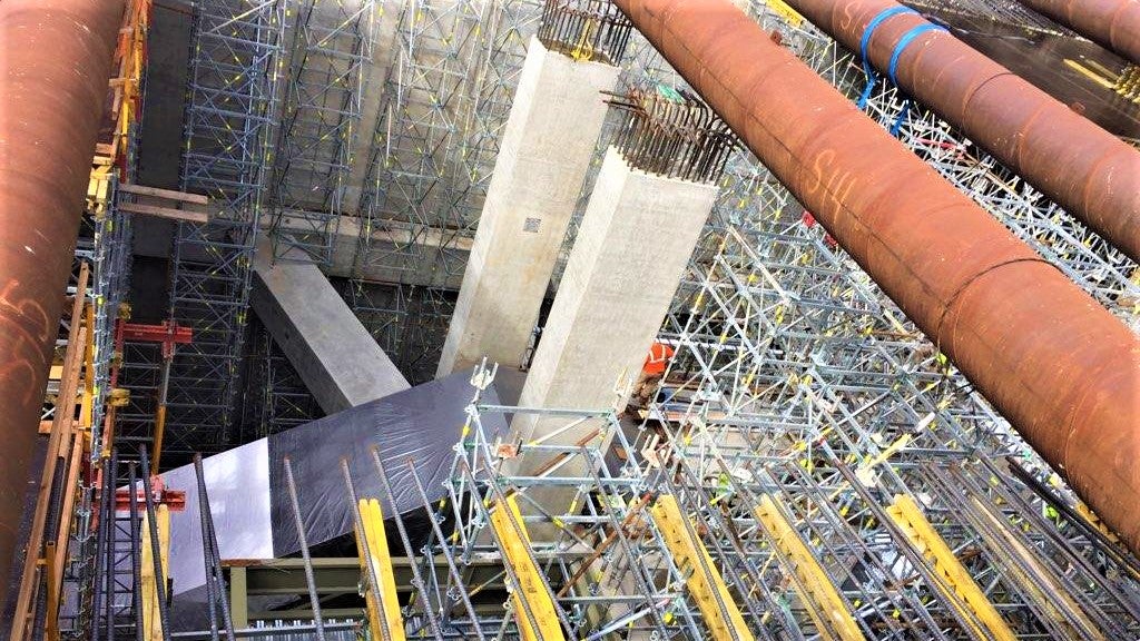 80+ ft. tall shoring towers used for construction of underground station