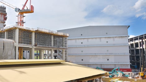 An overview of an old warehouse at the foreground that are waiting to be demolish in order to build a new warehouse by using PERI systems.