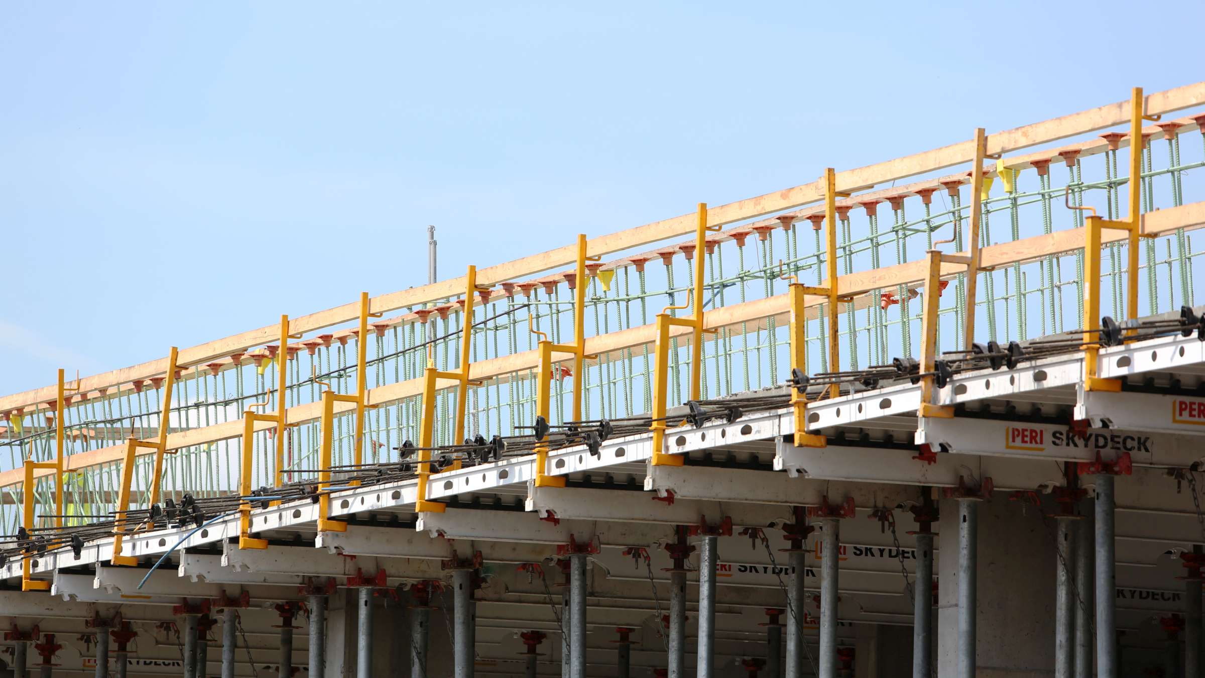SKYDECK Beams have "teeth" pre-installed on them, so panels are simply dropped onto the beams and stay in place