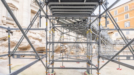 The scaffolding supports were placed on rubber pads and wooden boards to protect the vulnerable surface of the Trevi Fountain.