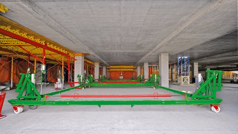 Specially-designed trolleys allow easy and quick moving operations in both longitudinal and lateral directions by hand. Prior to this, the load on the tables was hydraulically released, and the tables were then gently lowered.